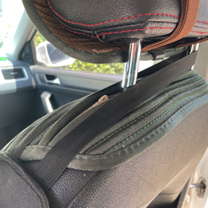 Upper telescopic strap over seat headrest